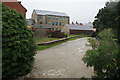 A swollen River Brit at Priory Mill