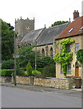 SK9857 : Navenby - church and old school by Dave Bevis
