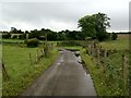 Junction of footpath tracks and lane Ireby