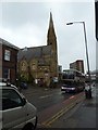 Approaching a church in Glossop Road