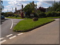 Grass covered road junction in Thornaugh