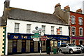 R0579 : Milltown Malbay - Main Street (N67) - Signs & The Restaurant - Bar, Victualler by Joseph Mischyshyn
