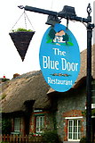 R4646 : Adare - Main Street - The Blue Door Restaurant Sign by Joseph Mischyshyn