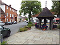 Woolpit village pump and shelter on The Street