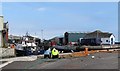 Repairing fishing nets on the quay at Kilkeel Harbour