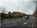 Looking across Broad Lane towards a bus shelter