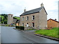 Stone house and the village church, Clyro