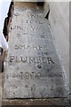 Lead memorial in Lady Chapel, Saxilby church