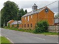 Converted farm buildings, by the A338 at Cholderton