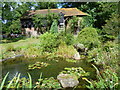 The pond and oast at Beech Court Gardens