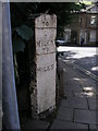 Cut benchmark on the milestone in the centre of Ripponden