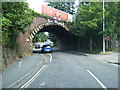 A3090 passes under the low railway bridge