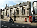 Motorcyclist passing the Roman Catholic Church