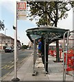 SJ9494 : Bus Shelter being painted by Gerald England