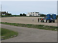 Farm workers planting up a field in North Foreland