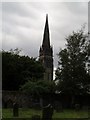 The tall spire of St Bryce Kirk