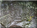NU0535 : Graffiti, St Cuthbert's Cave by Tim Heaton