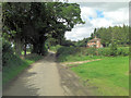 Un-named lane passes Upper Wyke Cottages