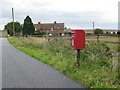 Post box on the road at Buscot Wick