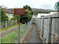 Footpath between a drainage channel and a car centre, Ynyswen