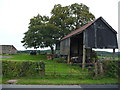 Old corrugated barn beside the road