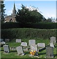 Burrough on the Hill: churchyard, east window and spire