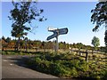 Road junction with tired sign