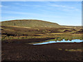 NY7922 : Bare peat and pool south-west of Mickle Fell by Trevor Littlewood