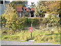 Badcall Inchard post box with ruins