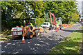 Cutting a trench in Campion Way