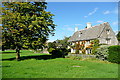 Green and houses at Wyck Rissington