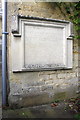 Benchmark and plaque on the Old School House