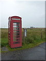 NF8457 : Grimsay: telephone box and noticeboard by Chris Downer