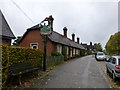 Village sign and Almshouses, High Street, Much Hadham