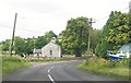 G9957 : A bend in the Lough Shore Road by Slawin's CoI Parish Church by Eric Jones