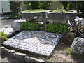 SX8673 : Millennium mosaic and planters, Kingsteignton by Robin Stott