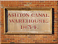 SJ9398 : Ashton Canal Warehouse Plaque by David Dixon