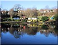 TQ3204 : Reflections on Queens Park Pond by Paul Gillett