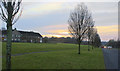 The sun setting over the approach to Witton Park  playing fields