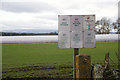 Signs beside polytunnels at Blairgowrie