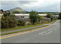 Talgarth : nearby industrial buildings and a distant mountain