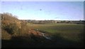 Flat farmland by the railway line