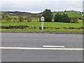 Milepost beside the A523