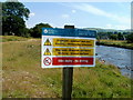 Warning notice on the bank of the Afon Sawdde near Llangadog