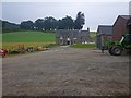 Dalbeathie House with broadleaf trees on ridge