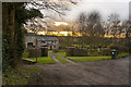 The sun sets behind a picturesque country home in Cram Lane