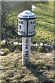 Milepost beside the A523