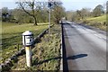 Milepost beside the A523