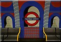 TQ2781 : Mural and chairs, Marble Arch Underground Station by Robin Sones