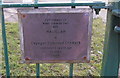 Plaque on gate into playground